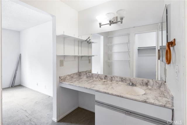 bathroom featuring vanity and a textured ceiling