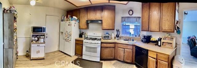 kitchen featuring white appliances, ventilation hood, sink, and light wood-type flooring