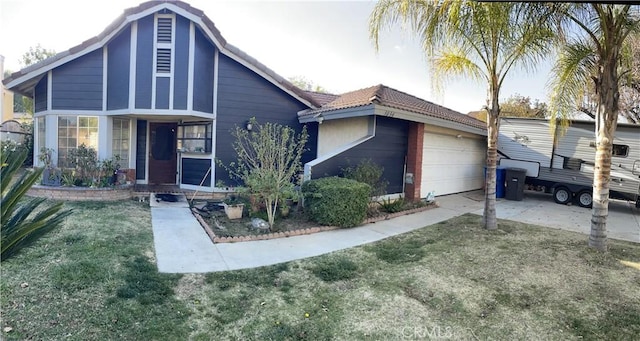 view of front of house featuring a garage and a front lawn