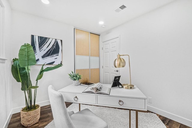 office area with dark wood-type flooring