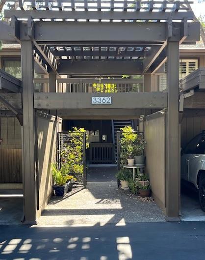 doorway to property with a carport