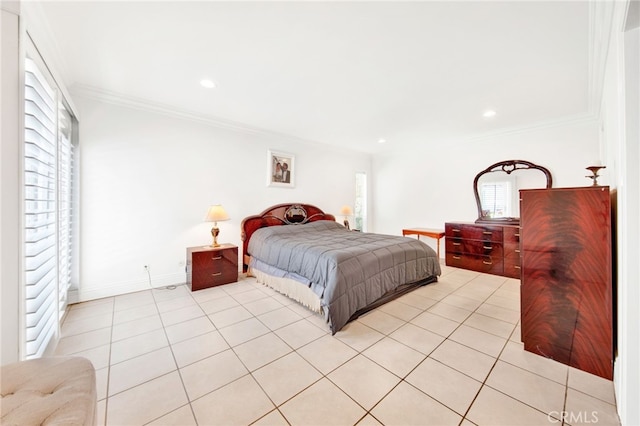 bedroom with ornamental molding and light tile patterned floors