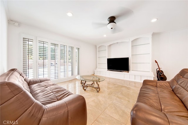 tiled living room with ceiling fan and built in shelves