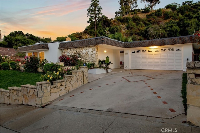 view of front of property with a garage