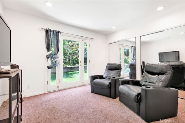 living room featuring french doors and carpet