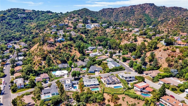 birds eye view of property with a mountain view