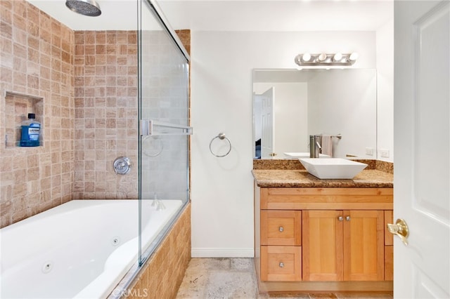 bathroom featuring vanity and combined bath / shower with glass door