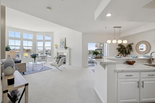 interior space with sink and light carpet