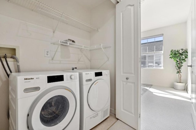 washroom with washer and clothes dryer