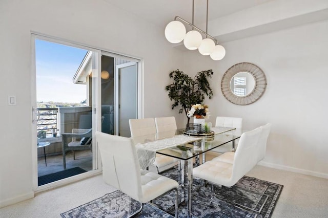 view of carpeted dining area