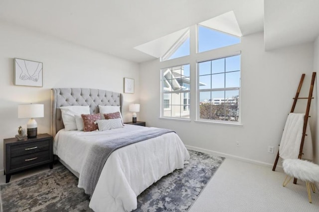 carpeted bedroom with lofted ceiling