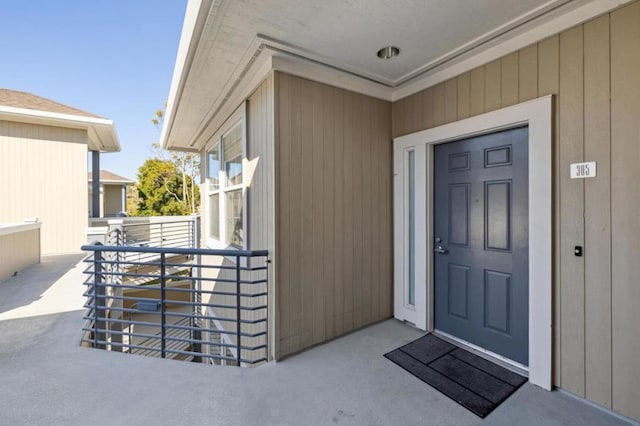 entrance to property with a balcony