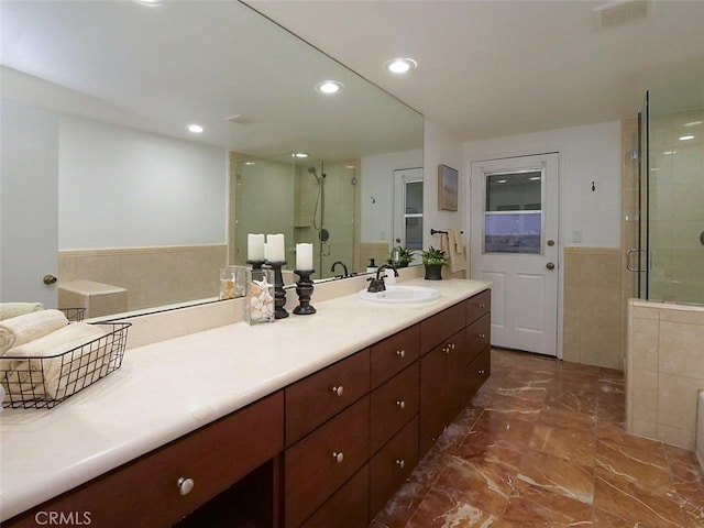 bathroom with vanity and an enclosed shower