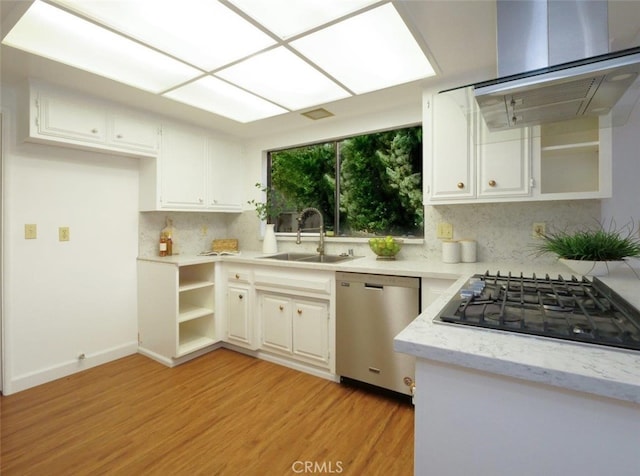 kitchen with black gas cooktop, sink, white cabinets, exhaust hood, and stainless steel dishwasher