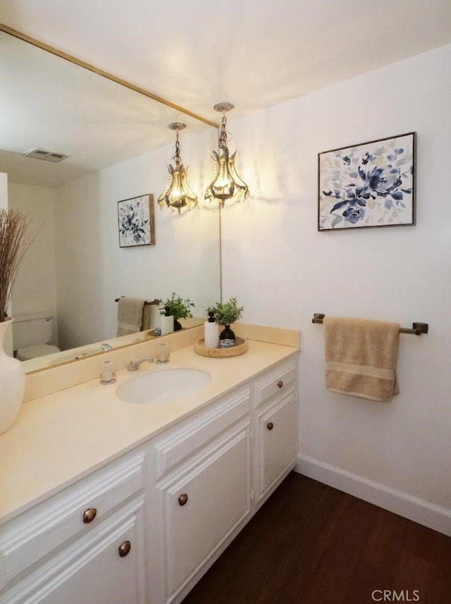 bathroom with vanity and hardwood / wood-style flooring