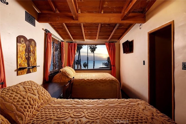 bedroom with vaulted ceiling with beams, wooden ceiling, and visible vents