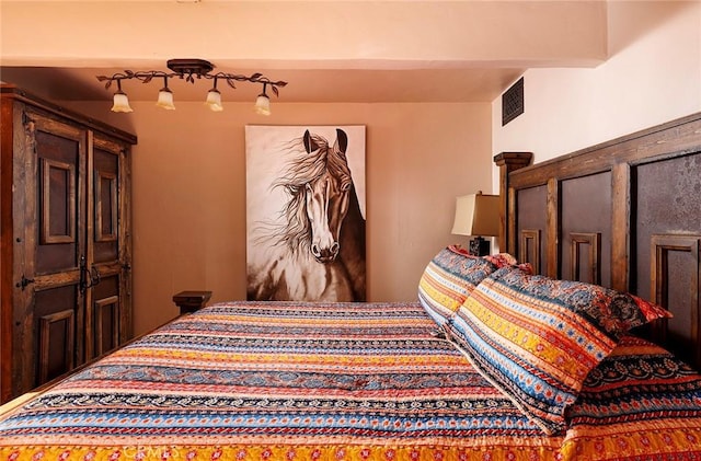 bedroom featuring visible vents