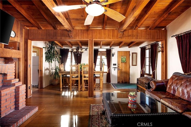 living room featuring dark hardwood / wood-style flooring, beam ceiling, and wooden ceiling