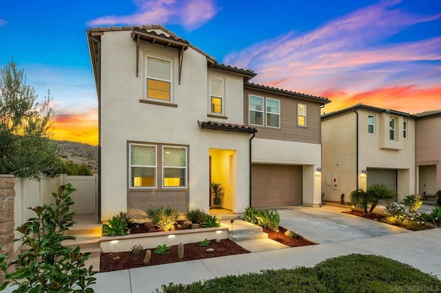 mediterranean / spanish-style home featuring a garage