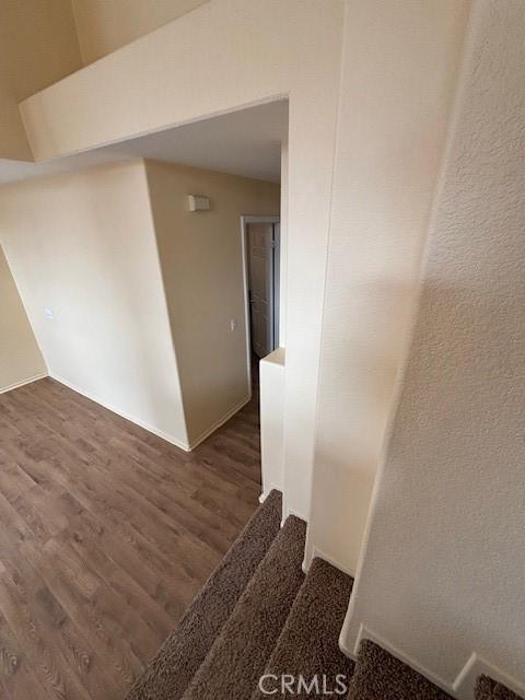 stairs featuring hardwood / wood-style flooring