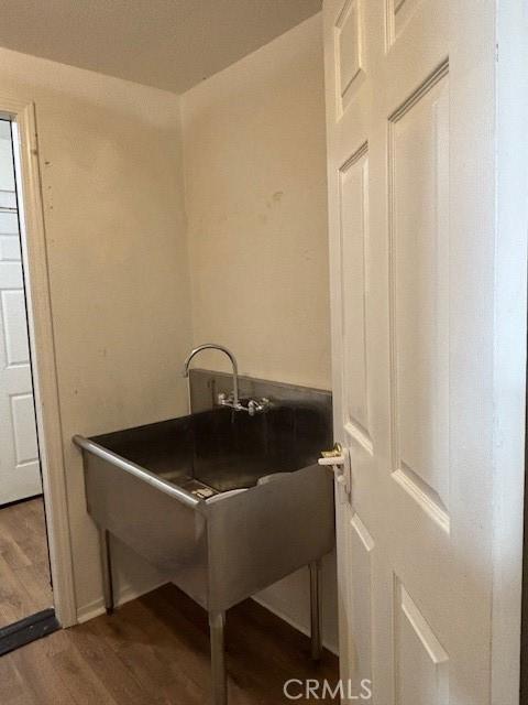 laundry area featuring dark hardwood / wood-style floors