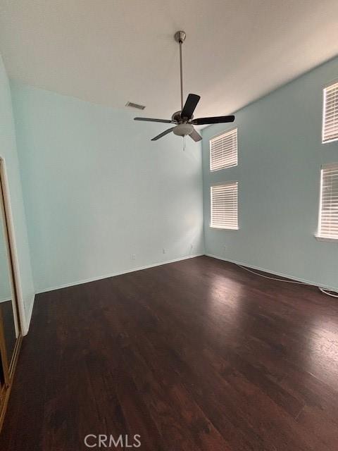 spare room featuring ceiling fan and wood-type flooring