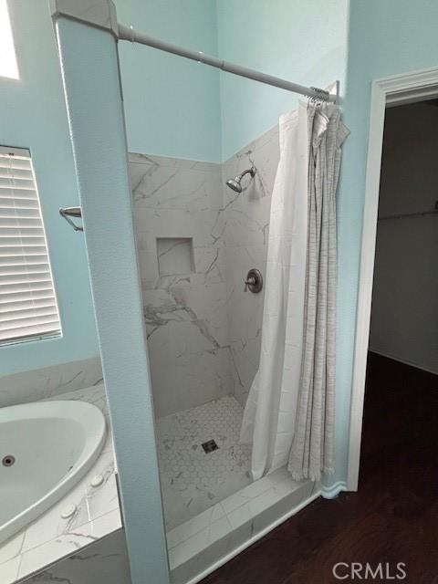 bathroom with a shower with shower curtain