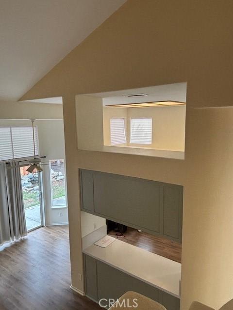 interior space with lofted ceiling and hardwood / wood-style flooring