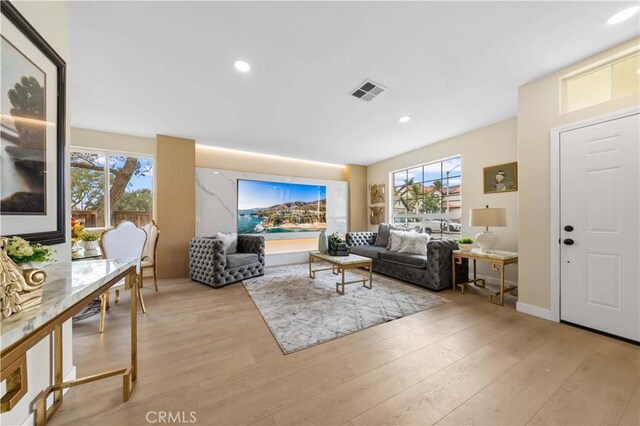 living room with light hardwood / wood-style floors