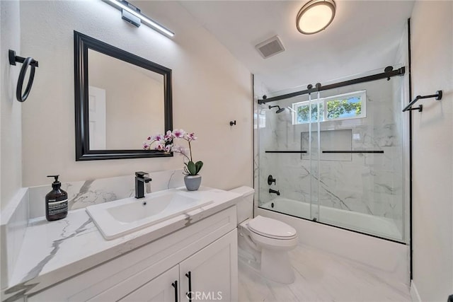 full bathroom with vanity, enclosed tub / shower combo, and toilet