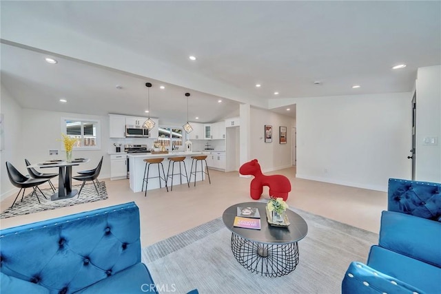 living room featuring lofted ceiling