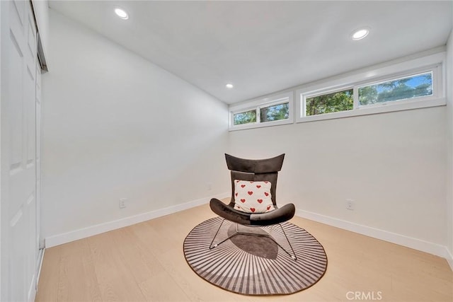 living area with light hardwood / wood-style flooring