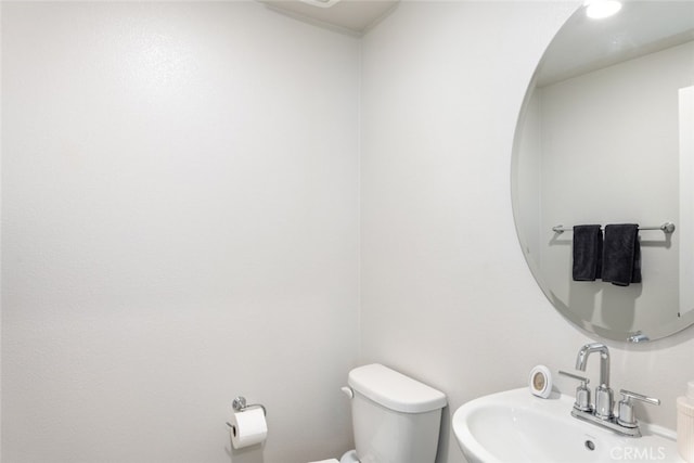 bathroom featuring sink and toilet