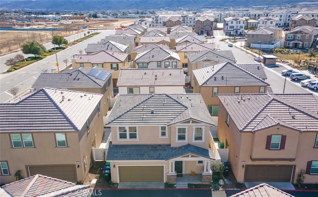 birds eye view of property with a mountain view