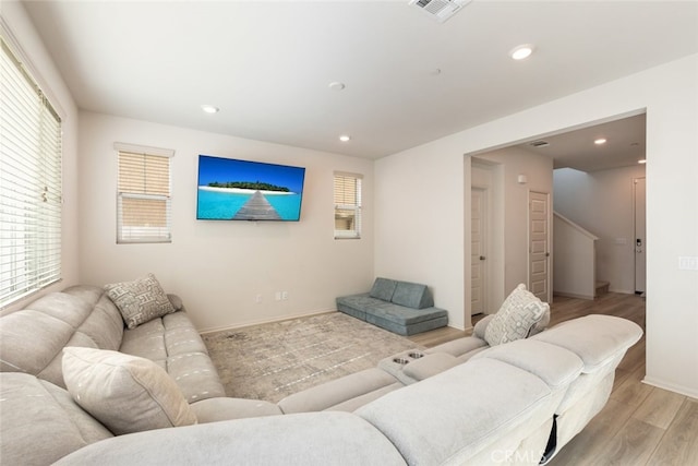 living room with light hardwood / wood-style flooring