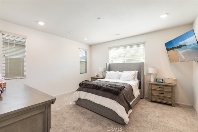 bedroom with light carpet