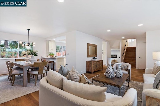 living room featuring hardwood / wood-style floors and a chandelier