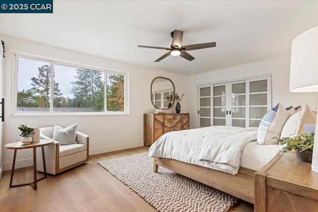 bedroom featuring ceiling fan and light wood-type flooring