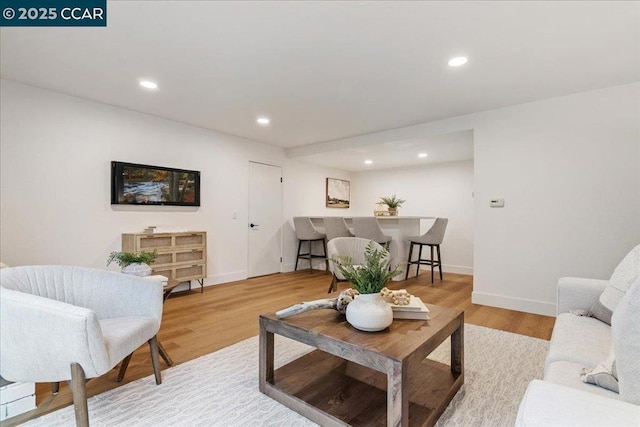 living room with light hardwood / wood-style floors