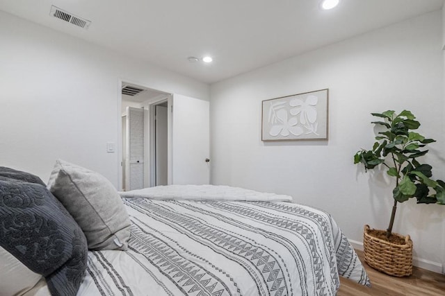 bedroom featuring wood-type flooring