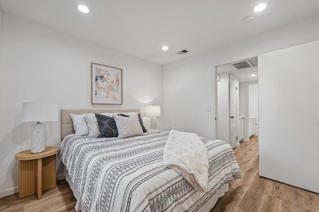 bedroom with light hardwood / wood-style floors