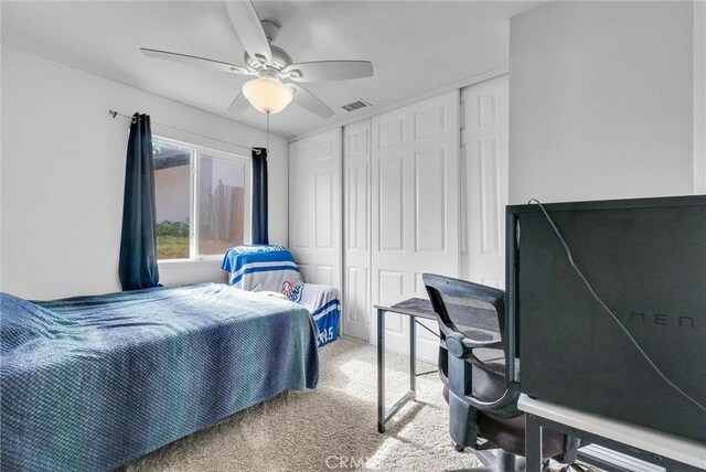 bedroom featuring carpet floors, a closet, and ceiling fan