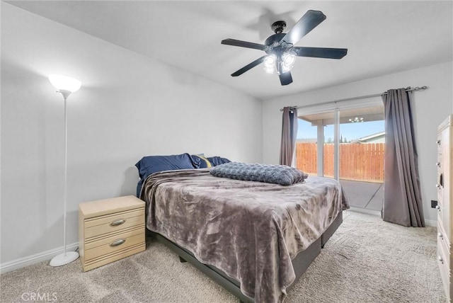 bedroom featuring ceiling fan, access to exterior, and light carpet