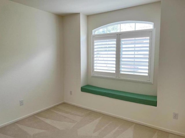 empty room featuring light colored carpet