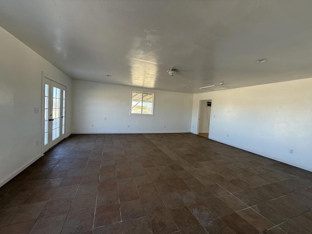 unfurnished room with french doors