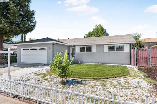 ranch-style house with a garage and a front lawn