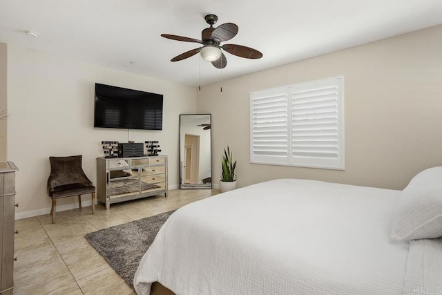 tiled bedroom with ceiling fan