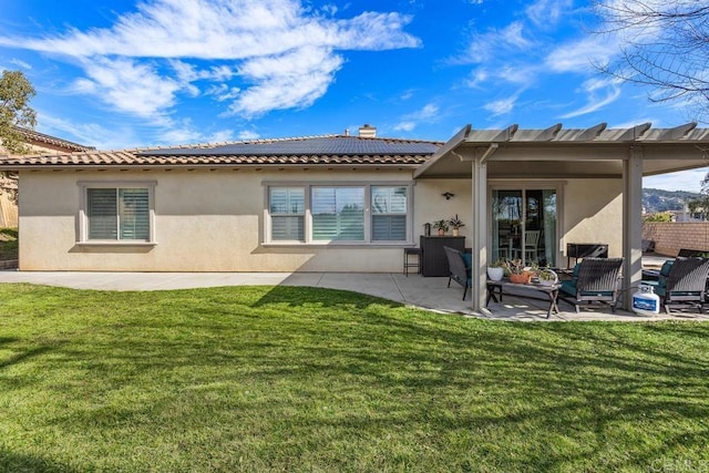 back of house with a patio and a yard