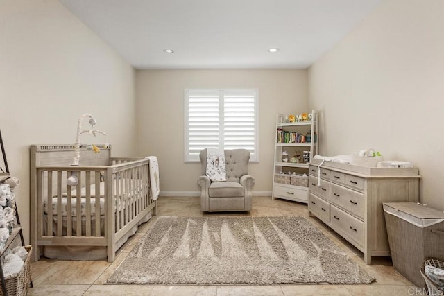 tiled bedroom with a crib