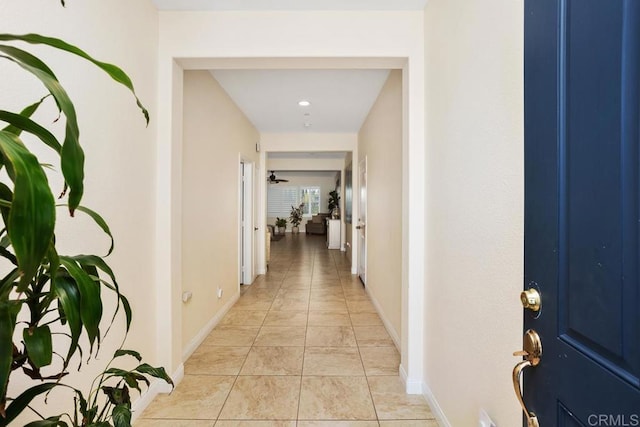 hallway featuring light tile patterned floors